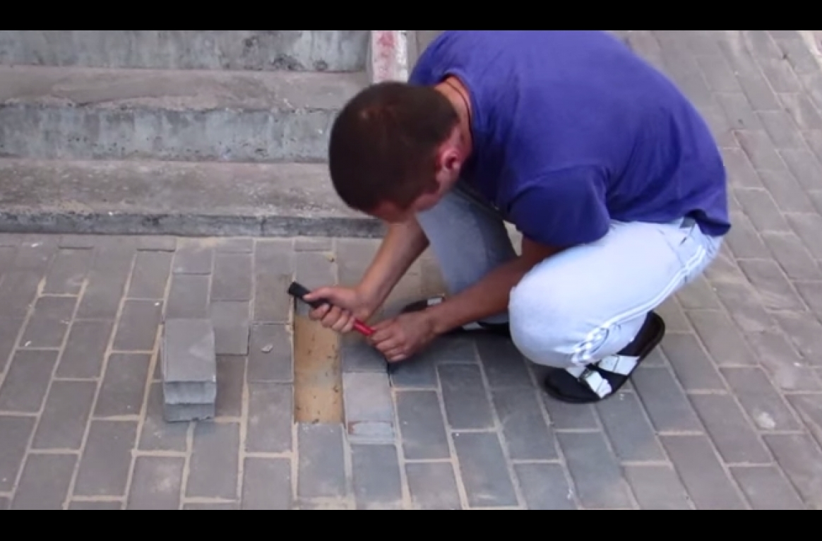 He heard something cries beneath the sidewalk, so he opened it. What came out was horrifying