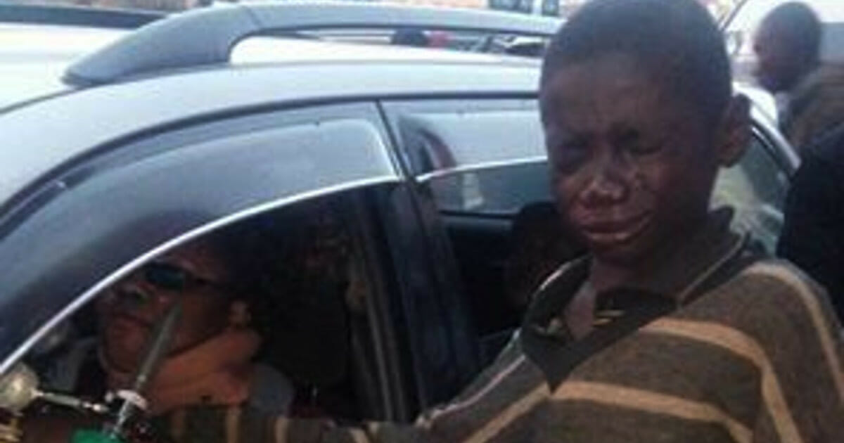 A boy went to a car to ask for money - so he looked inside and started bursting in tears