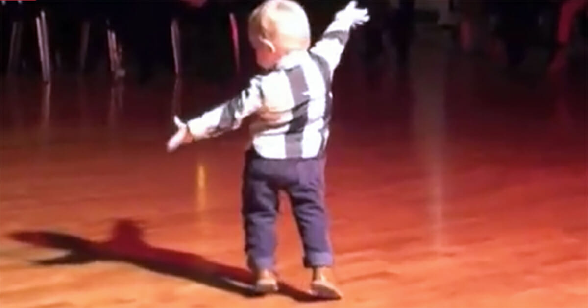 A toddler heard his favorite Elvis Presley song at the party, now watch him turn around and drop you to the floor