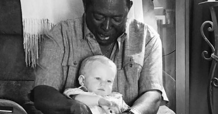 A neighbor asked to hold the baby, so the father looked closely at the photo and revealed the truth